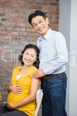 Portrait of happy expectant couple