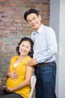 Portrait of happy expectant couple