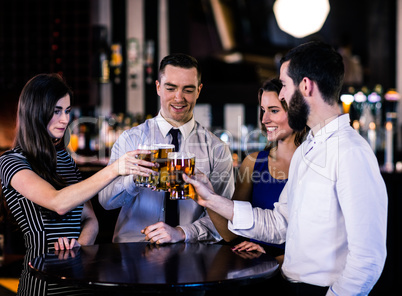 Friends toasting with a beer