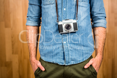 Hipster man holding digital camera