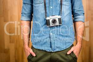 Hipster man holding digital camera