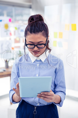 Asian businesswoman using tablet