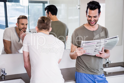 Smiling gay couple in the bathroom