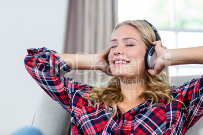 Woman listening to music on the couch