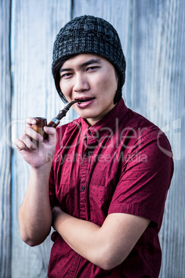 Hipster smoking pipe