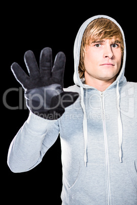 Man with black gloves staring at camera