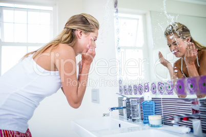 Woman washing her face