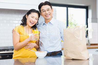 Portrait of happy expectant couple