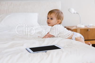 Cute baby climbing down the bed