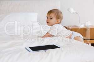 Cute baby climbing down the bed