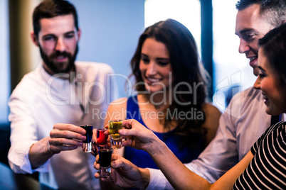 Friends toasting with alcohol shots