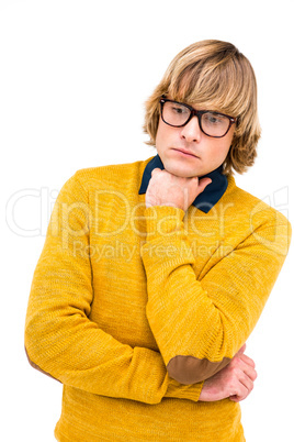 Portrait of thoughtful hipster businessman with hand on chin