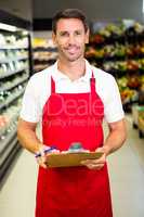 Smiling worker with clipboard