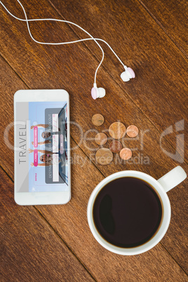 Composite image of view of a white smartphone with a cup of coff