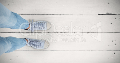 Composite image of woman wearing trainers