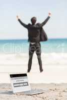 Composite image of happy businessman cheering in front of the se
