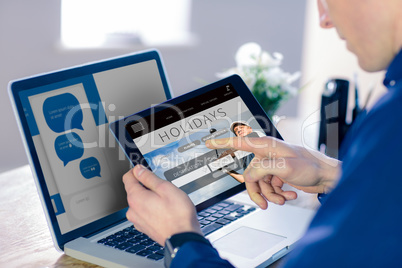 Composite image of businessman using tablet computer in office