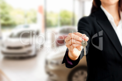 Composite image of close up of a confident businesswoman holding