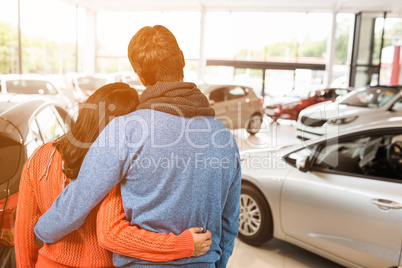 Composite image of rear view of couple against white background