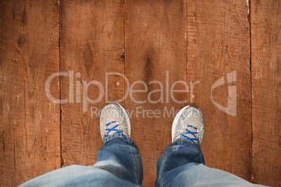 Composite image of casually dressed mans feet