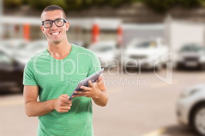 Composite image of smiling man wearing glasses while holding dig