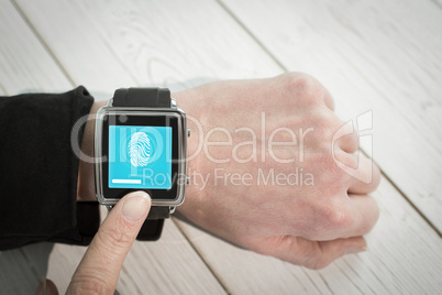 Composite image of businesswoman using a smart watch