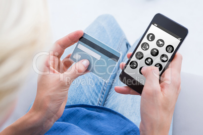 Composite image of woman doing online shopping with her mobile p