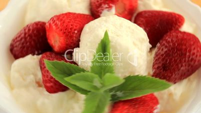 Dessert with strawberry ice cream and mint