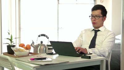Asian Businessman Business Man Working With Laptop Pc During Breakfast