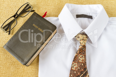 Christian man style clothes and Holy Bible at home