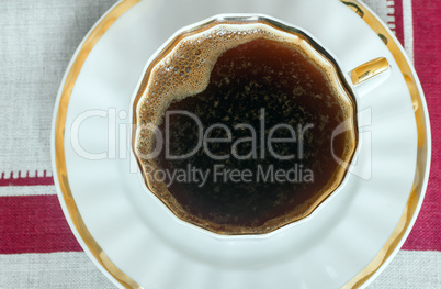 Close up of a Cup of black coffee . The view from the top.