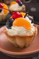 Basket of dough with cream and cherry