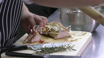 The Cook prepares meat