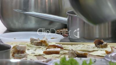 The Cook prepares meat