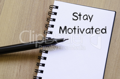 Stay motivated write on notebook