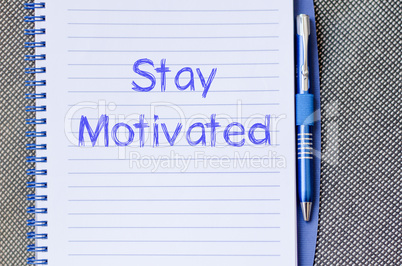 Stay motivated write on notebook