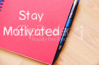 Stay motivated write on notebook