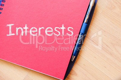 Interests write on notebook