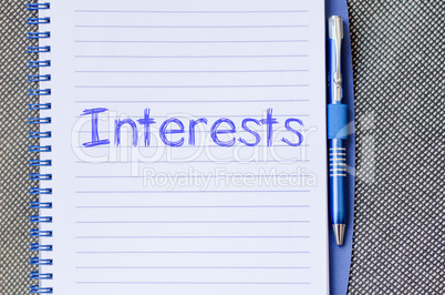 Interests write on notebook