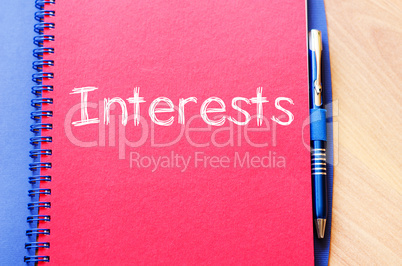 Interests write on notebook