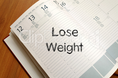 Lose weight write on notebook