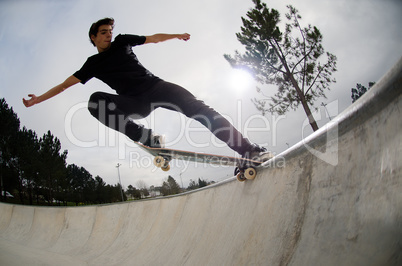 Skateboarder doing a tail slide