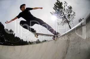 Skateboarder doing a tail slide