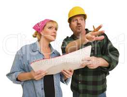 Contractor in Hard Hat Discussing Plans with Woman On White
