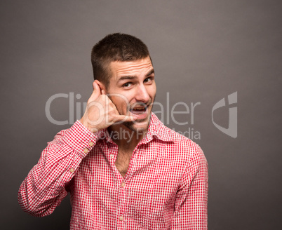 Man making phone gesture