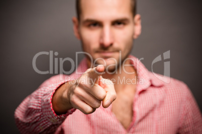 Man pointing his finger at you