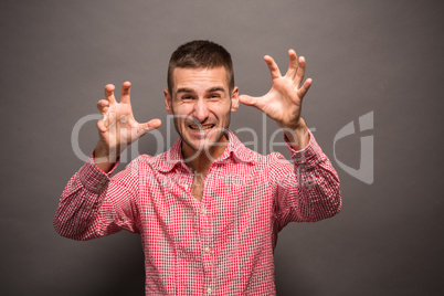 Young man with his hands in air