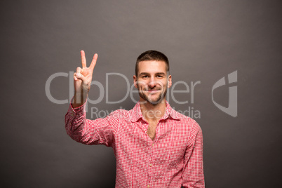 Handsome man showing okay sign