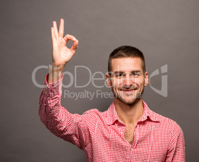 Handsome man showing okay sign