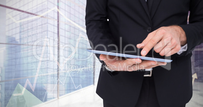 Composite image of mid section of a businessman touching digital